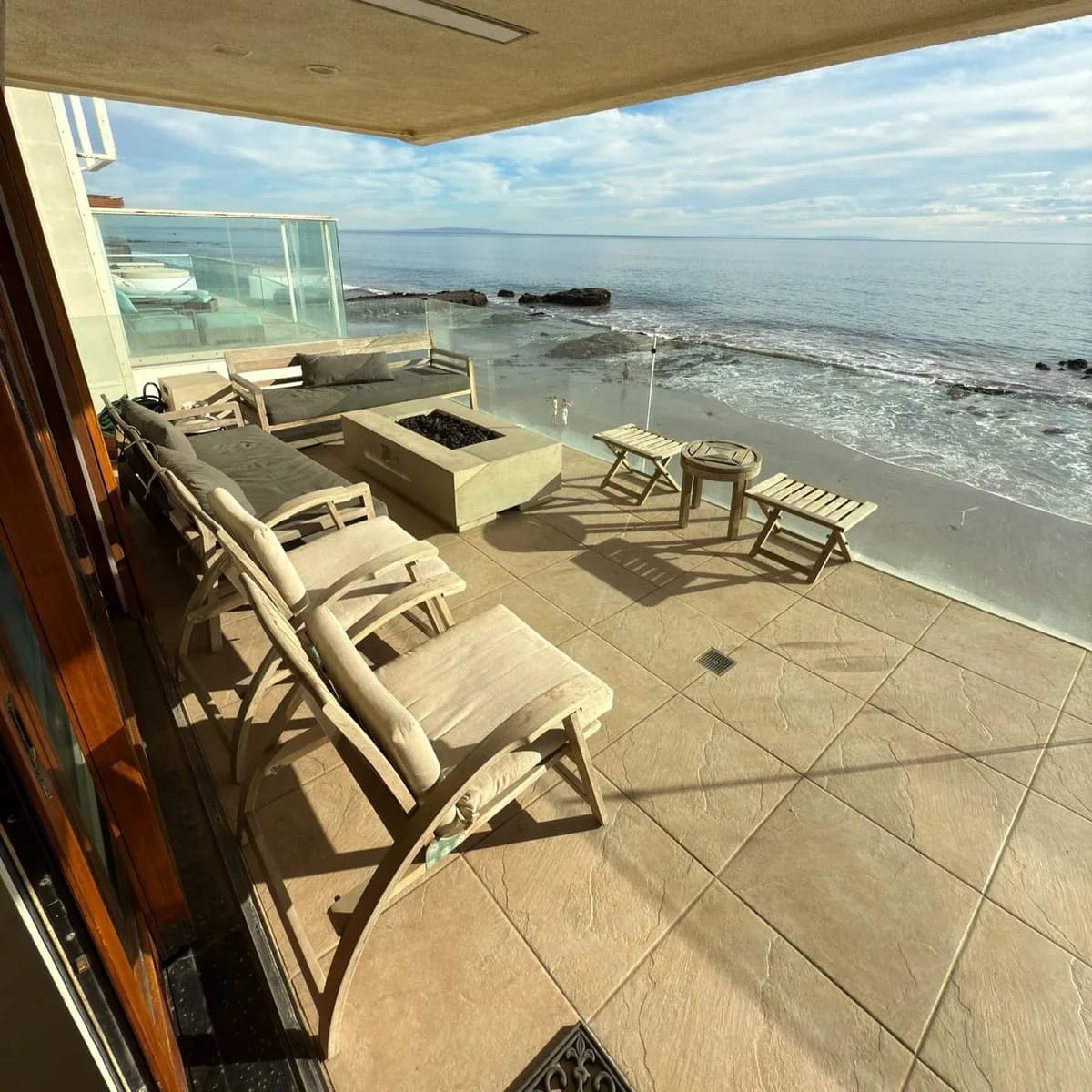 Oceanfront outdoor living area prepared for guests